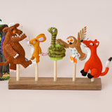 Set of Gruffalo plush toys on a stand with a Gruffalo book in the background.
