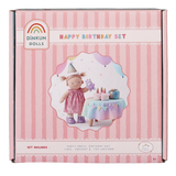 Dinkum Dolls Happy Birthday set packaging with a striped design and doll illustration on a white background.