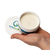 Hand holding a jar of Belly Bands product with visible branding on a white background