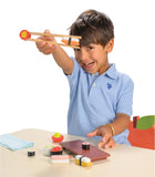 Child playing with a toy sushi set on a white background